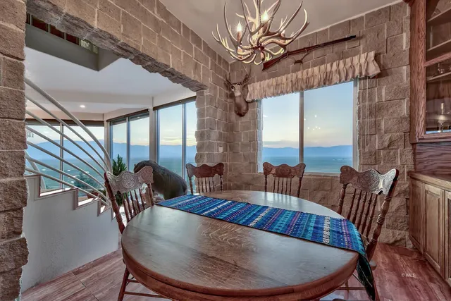 a view of a dining room with furniture window and wooden floor