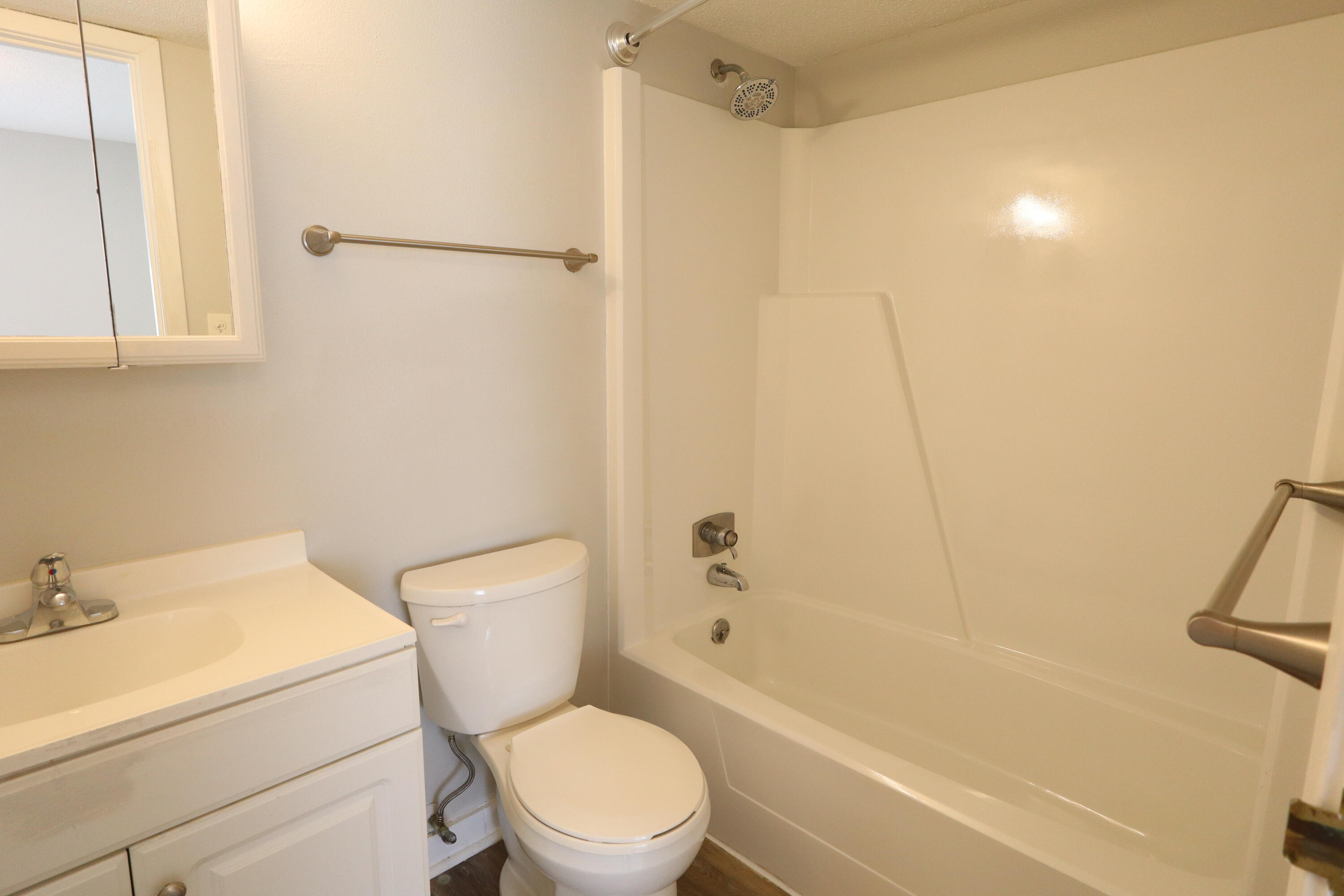 101 Old Ferry Road, Unit 36D Shalimar, FL 32579 - Photo 11 of 17 a white toilet sitting next to a bath tub