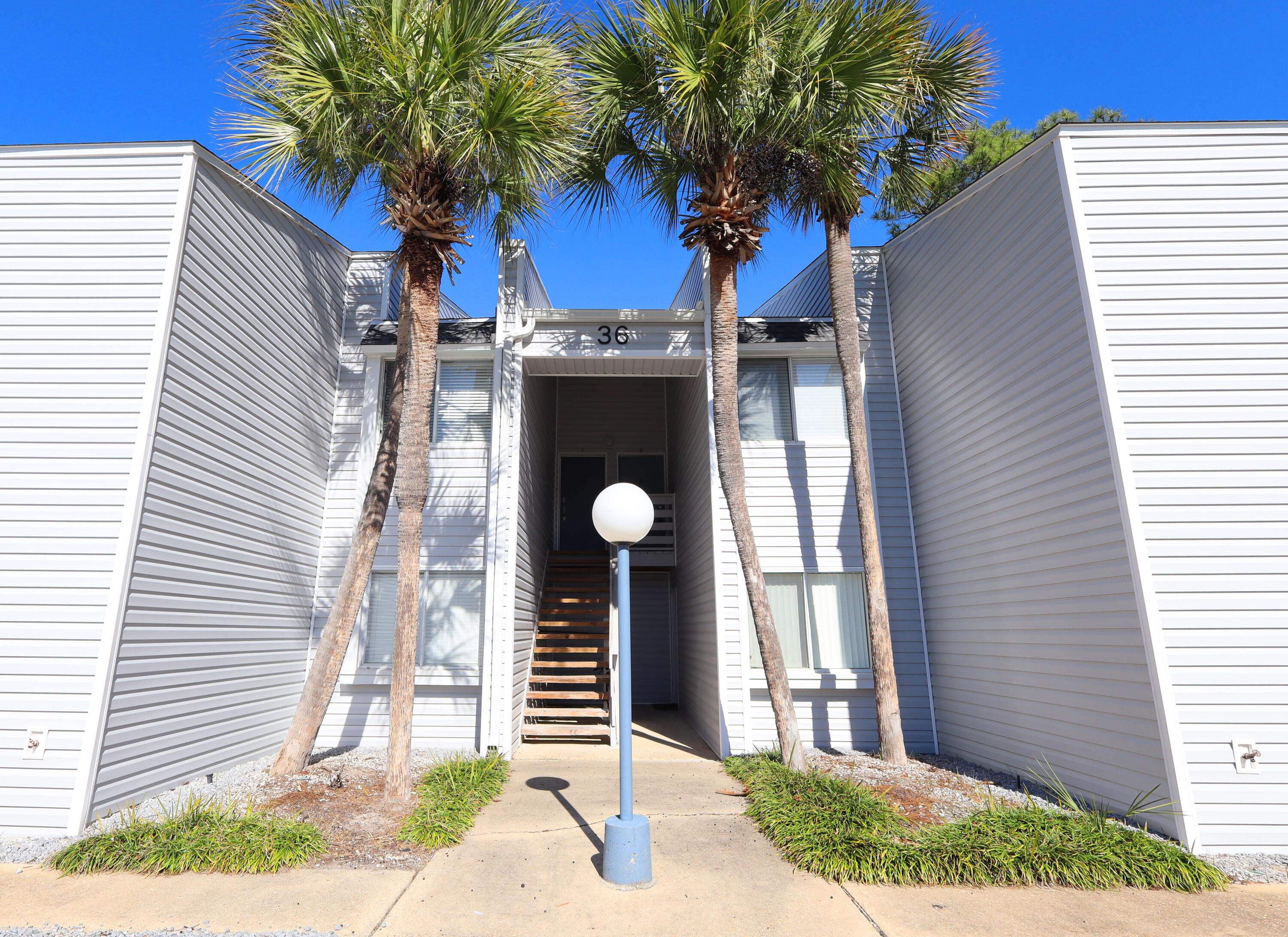 101 Old Ferry Road, Unit 36D Shalimar, FL 32579 - Photo 3 of 17 a front view of a house with garden