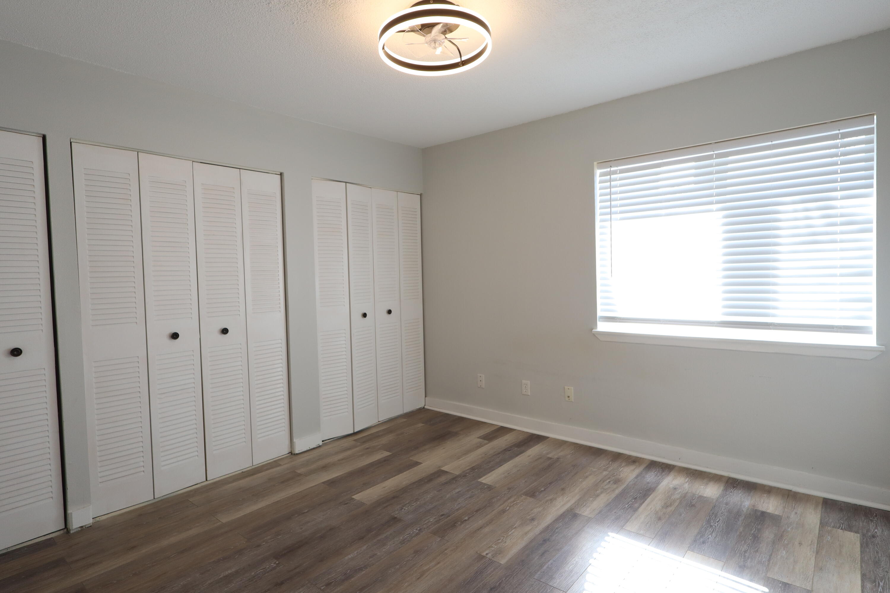 101 Old Ferry Road, Unit 36D Shalimar, FL 32579 - Photo 10 of 17 a view of a room with wooden floor and window