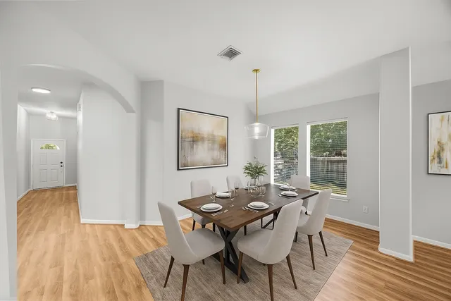 a view of a dining room with furniture window and outside view