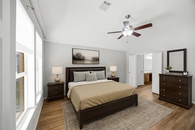 a bedroom with a bed and a dresser