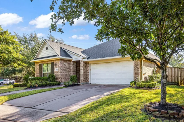a view of house that has a tree in it