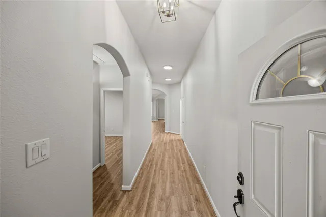 a view of a hallway with staircase