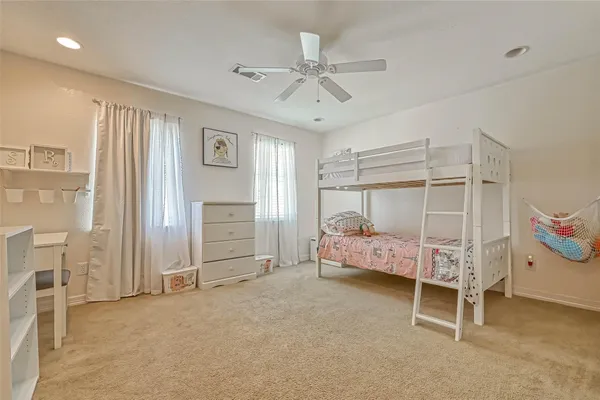 a bedroom with furniture and a window