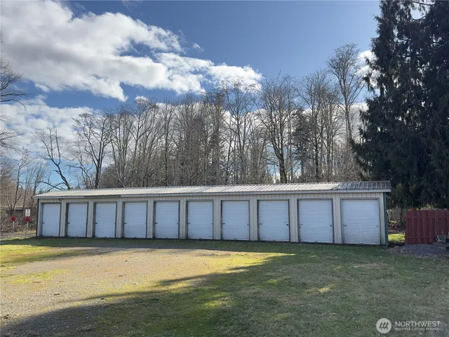 a view of a backyard with large trees