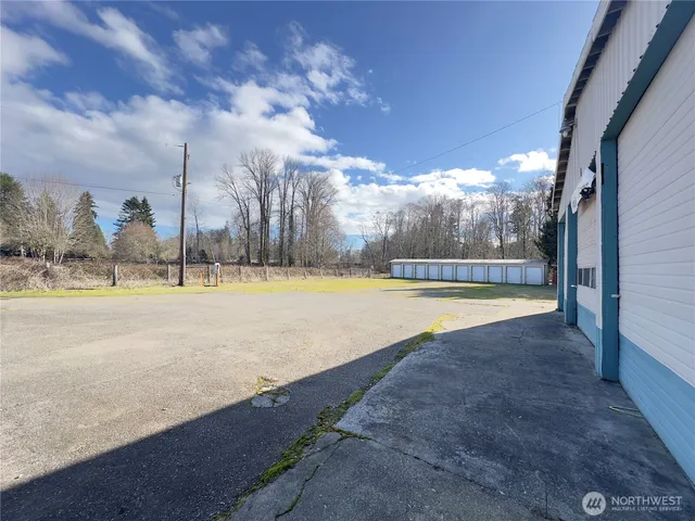 a view of a swimming pool with an outdoor space and seating area