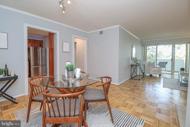 a living room with a couch and a table with rug