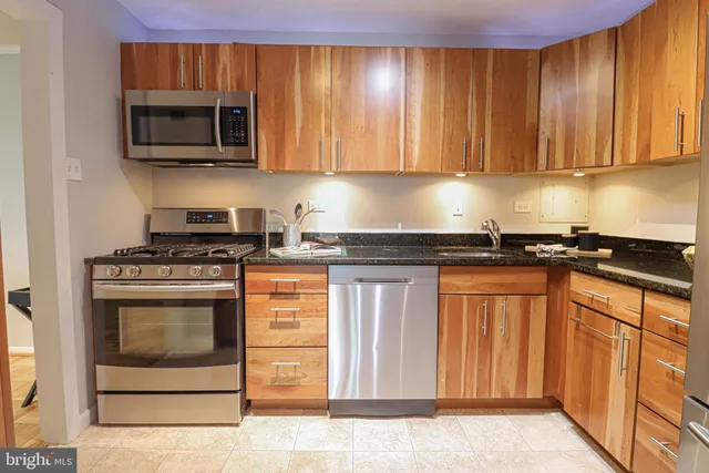 a kitchen with a stove and a refrigerator