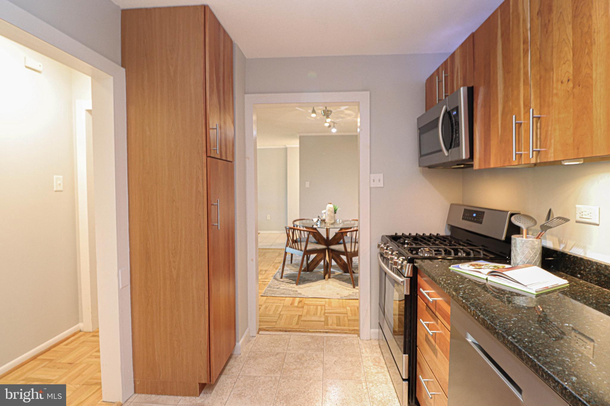700 7th Street Southwest, Unit 608 Washington, DC 20024 - Photo 13 of 45 a kitchen with a stove and a refrigerator