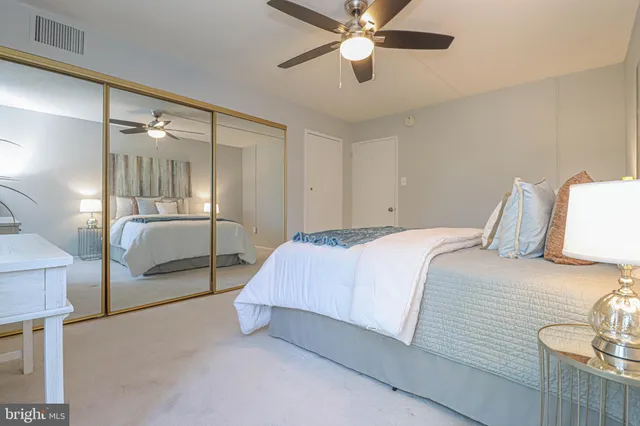 a spacious bathroom with a sink mirror and toilet