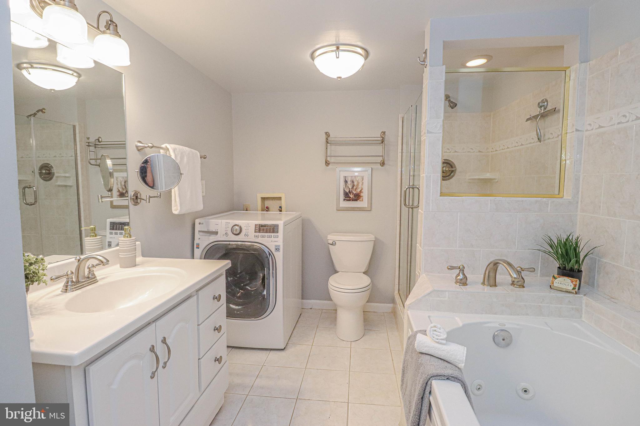700 7th Street Southwest, Unit 608 Washington, DC 20024 - Photo 17 of 45 a spacious bathroom with a sink mirror and toilet