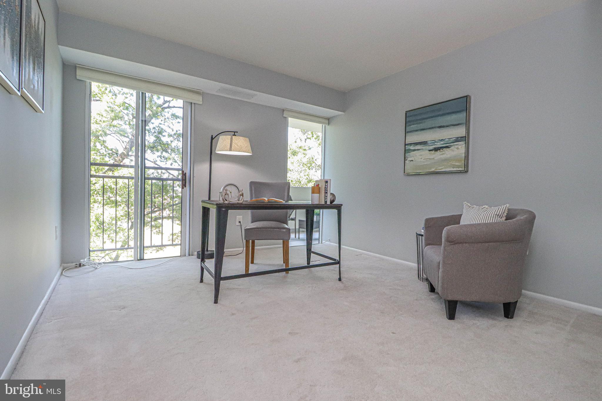 700 7th Street Southwest, Unit 608 Washington, DC 20024 - Photo 21 of 45 a living room with furniture and a window