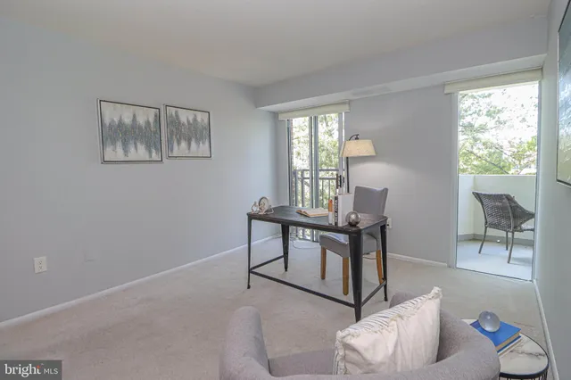 a view of a workspace with furniture