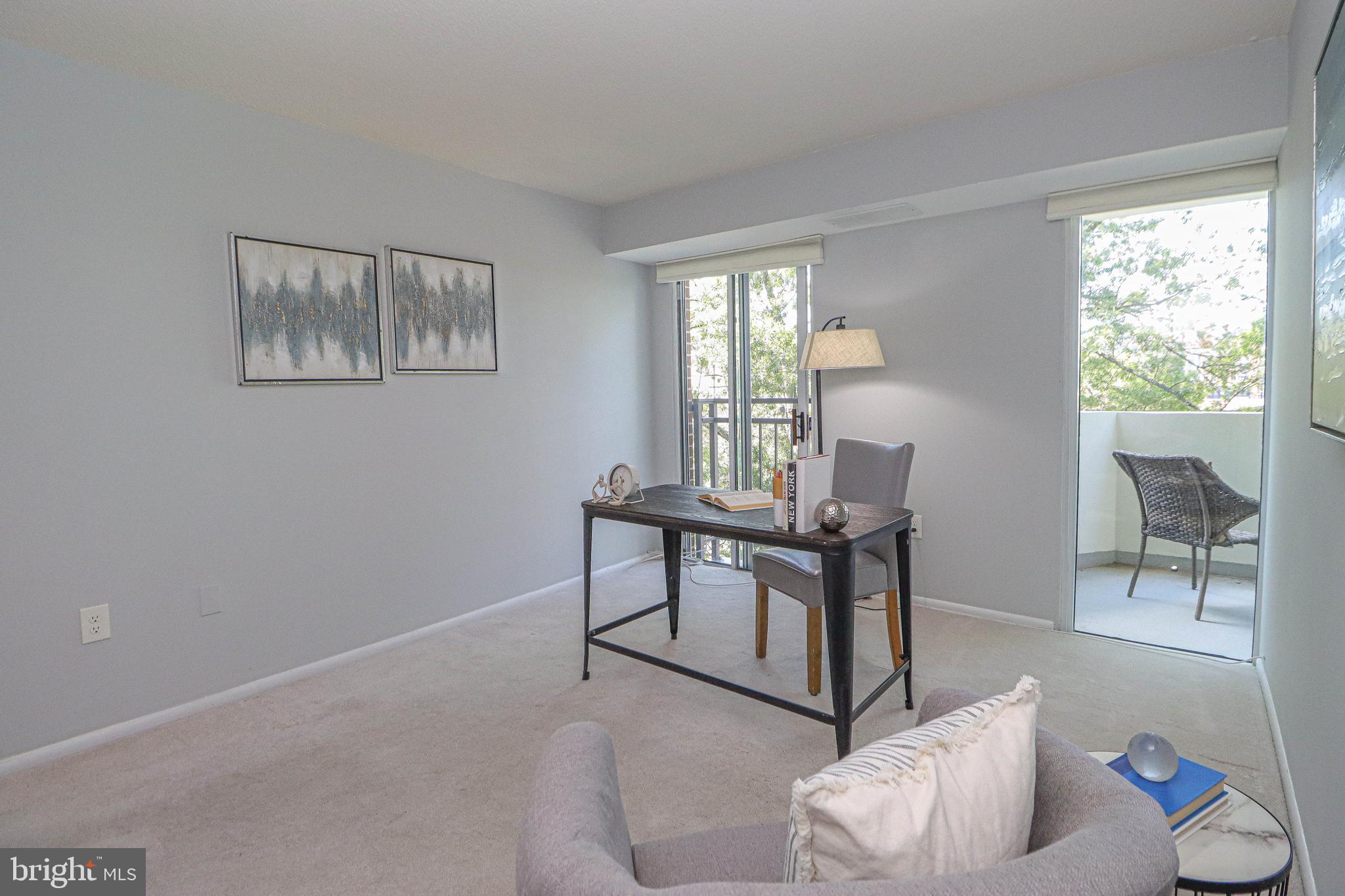 700 7th Street Southwest, Unit 608 Washington, DC 20024 - Photo 22 of 45 a living room with furniture and a window