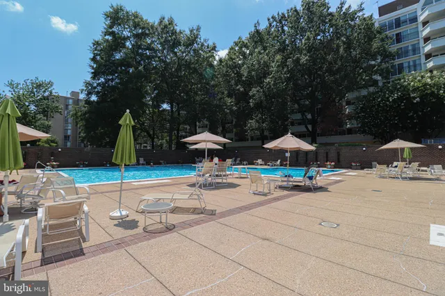 a front view of a building with a garden