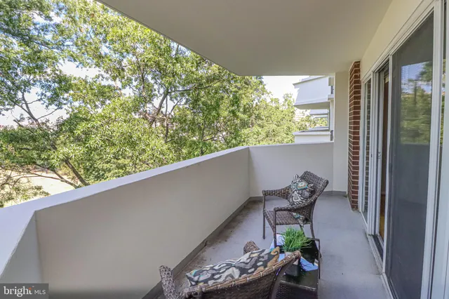 a view of a city with lush green forest