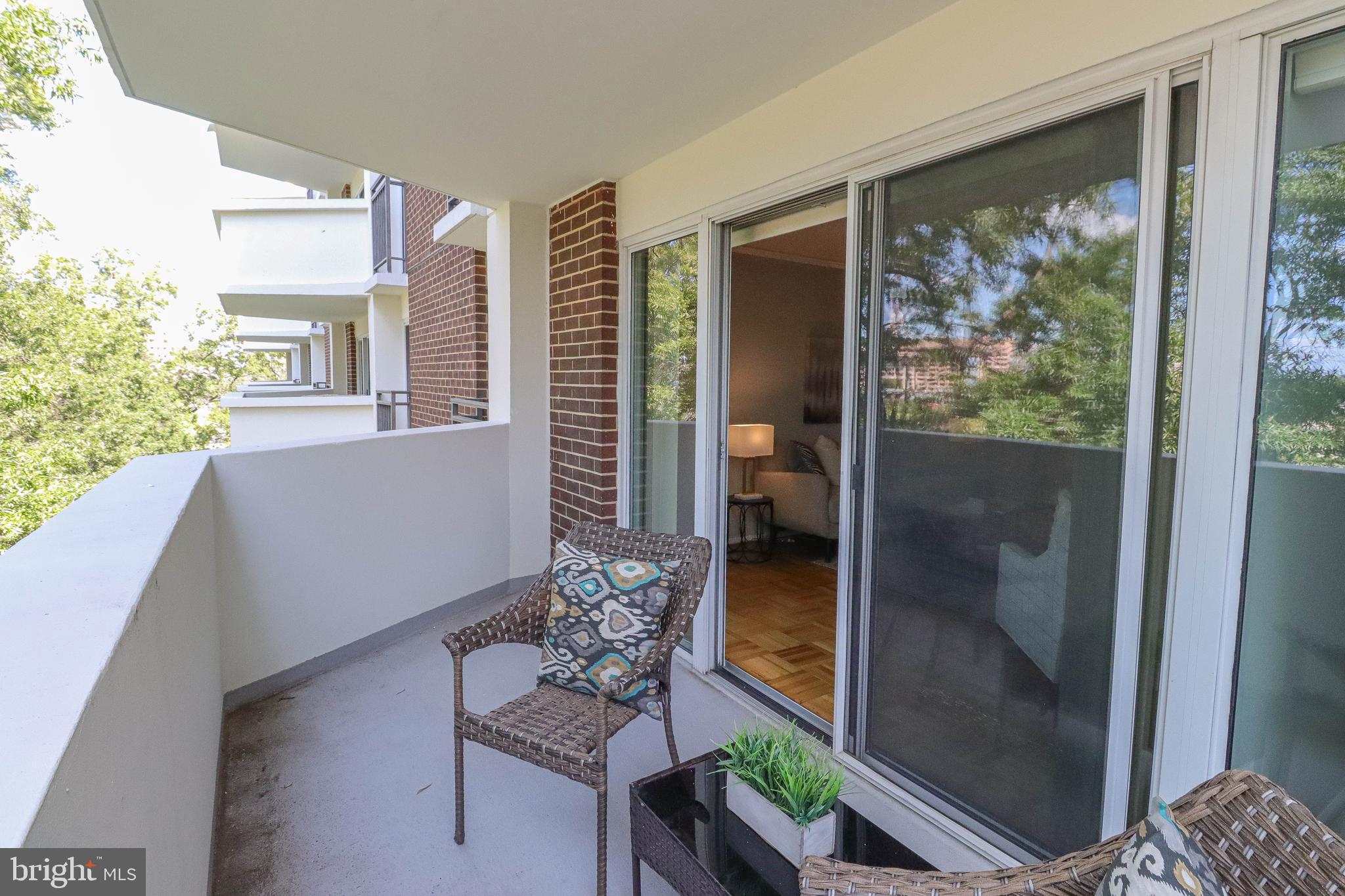 700 7th Street Southwest, Unit 608 Washington, DC 20024 - Photo 7 of 45 a living room with furniture and a floor to ceiling window