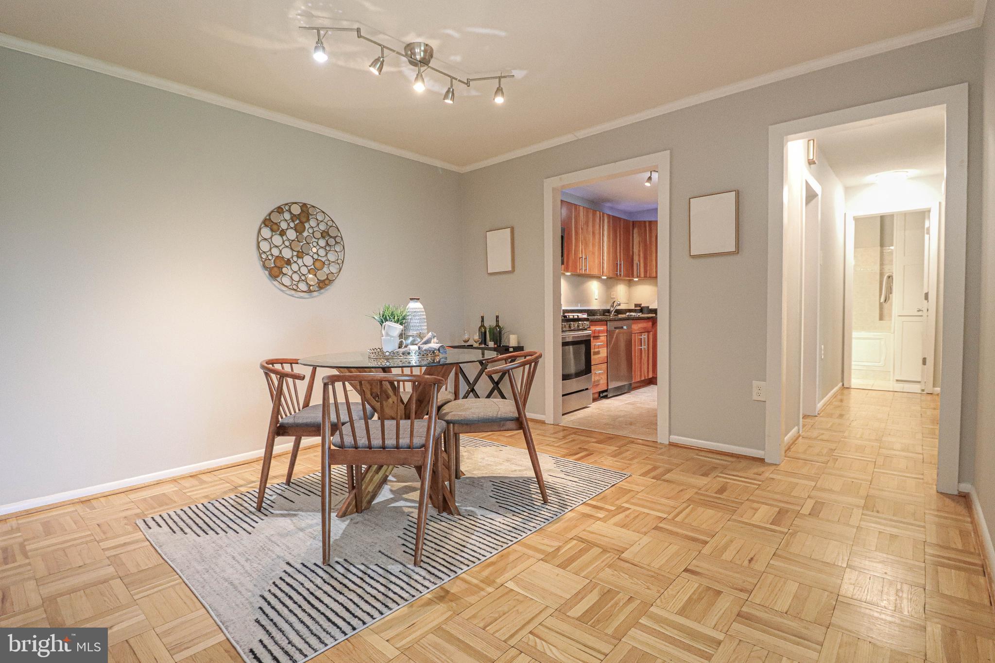 700 7th Street Southwest, Unit 608 Washington, DC 20024 - Photo 10 of 45 a dining room with a table and chairs