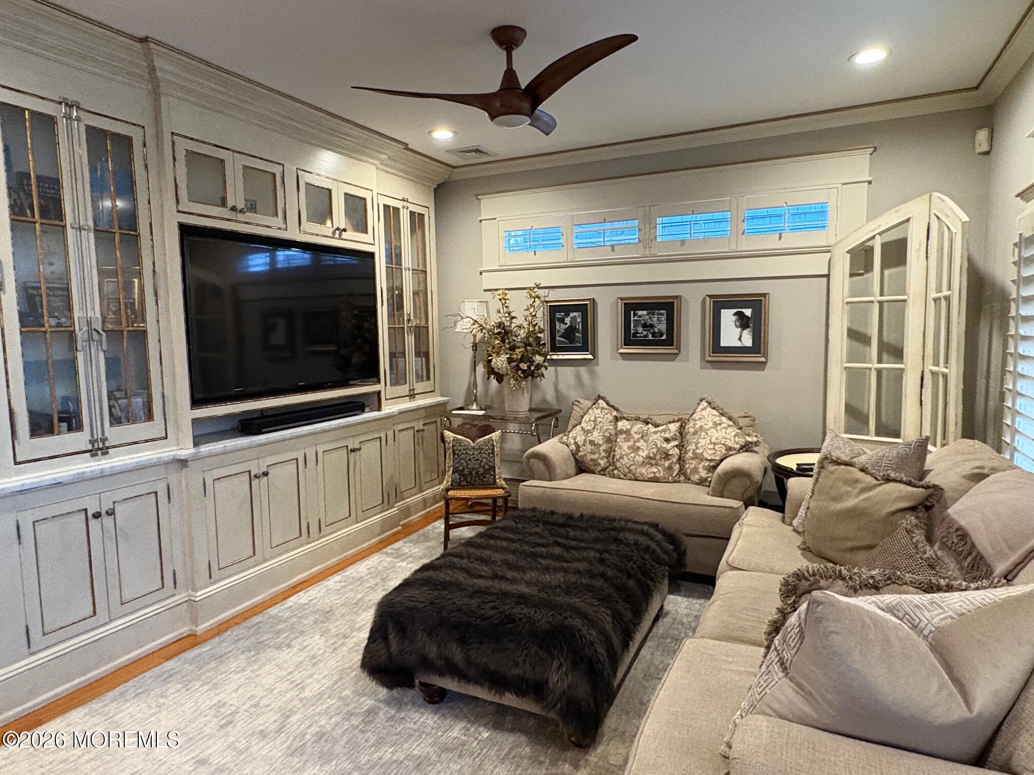 162 Bridge Avenue Red Bank, NJ 07701 - Photo 2 of 27 a living room with furniture a flat screen tv and a window