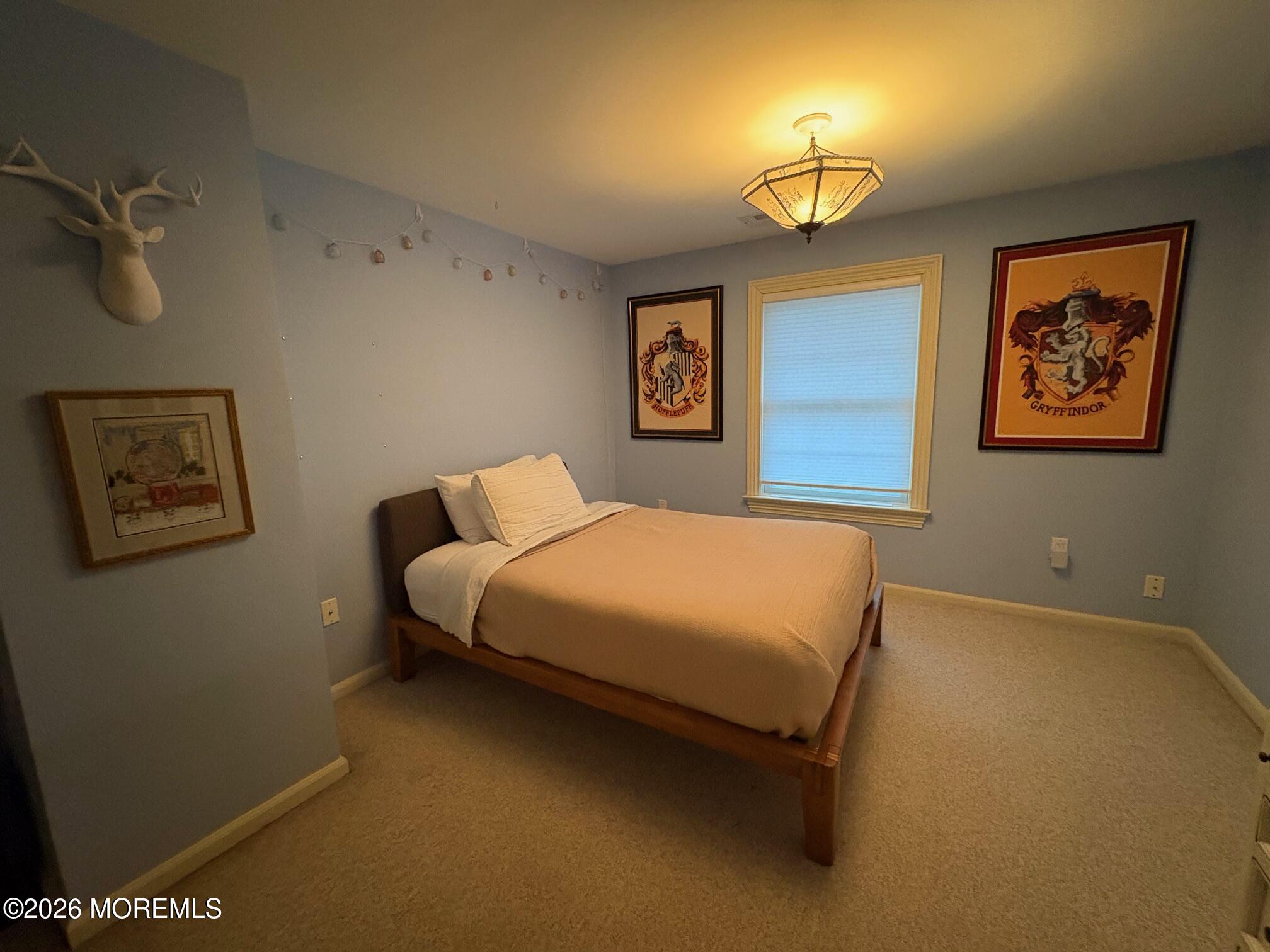162 Bridge Avenue Red Bank, NJ 07701 - Photo 23 of 27 a bedroom with a bed and a painting on the wall