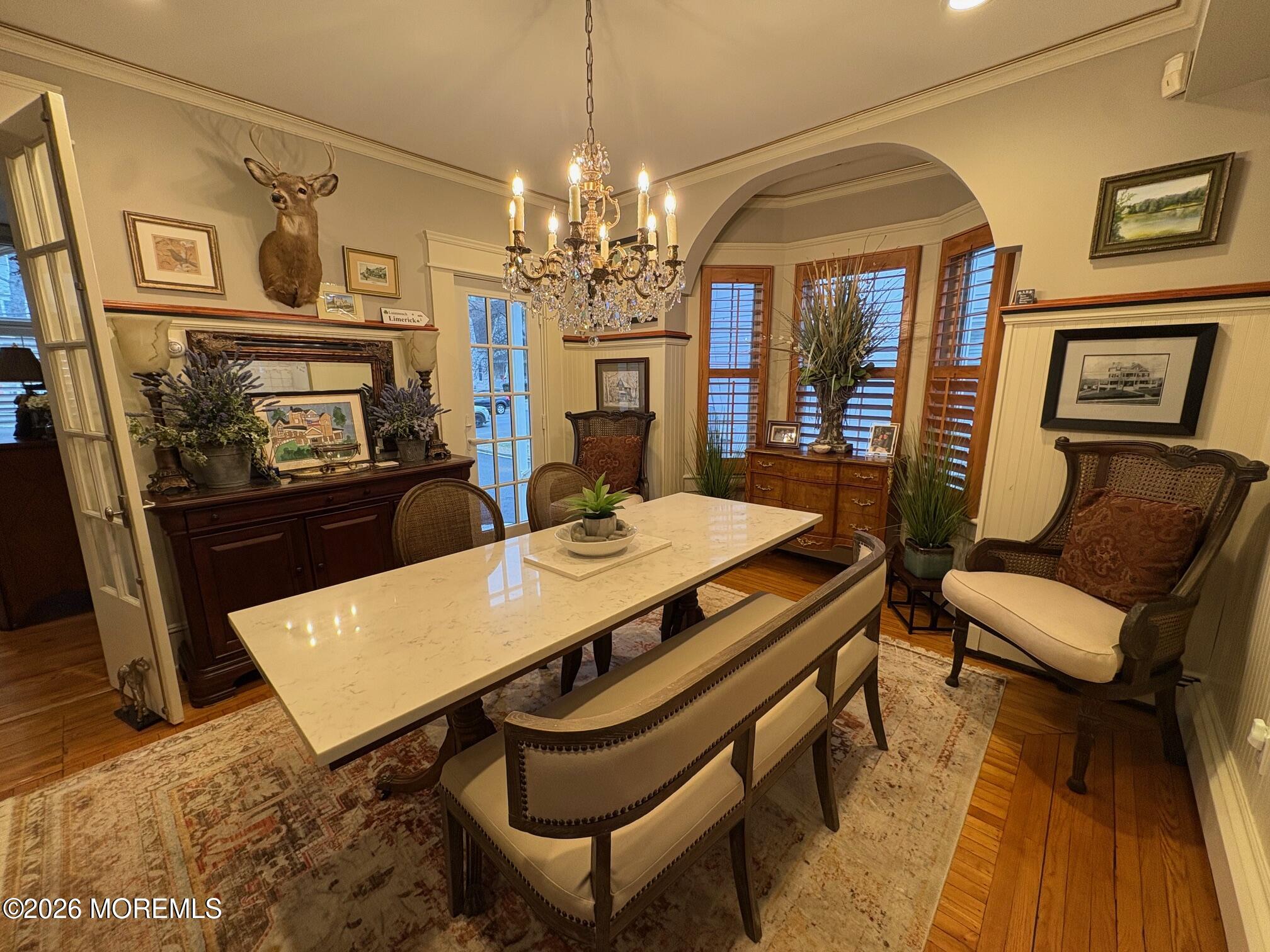 162 Bridge Avenue Red Bank, NJ 07701 - Photo 4 of 27 a view of a dining room with furniture and a chandelier