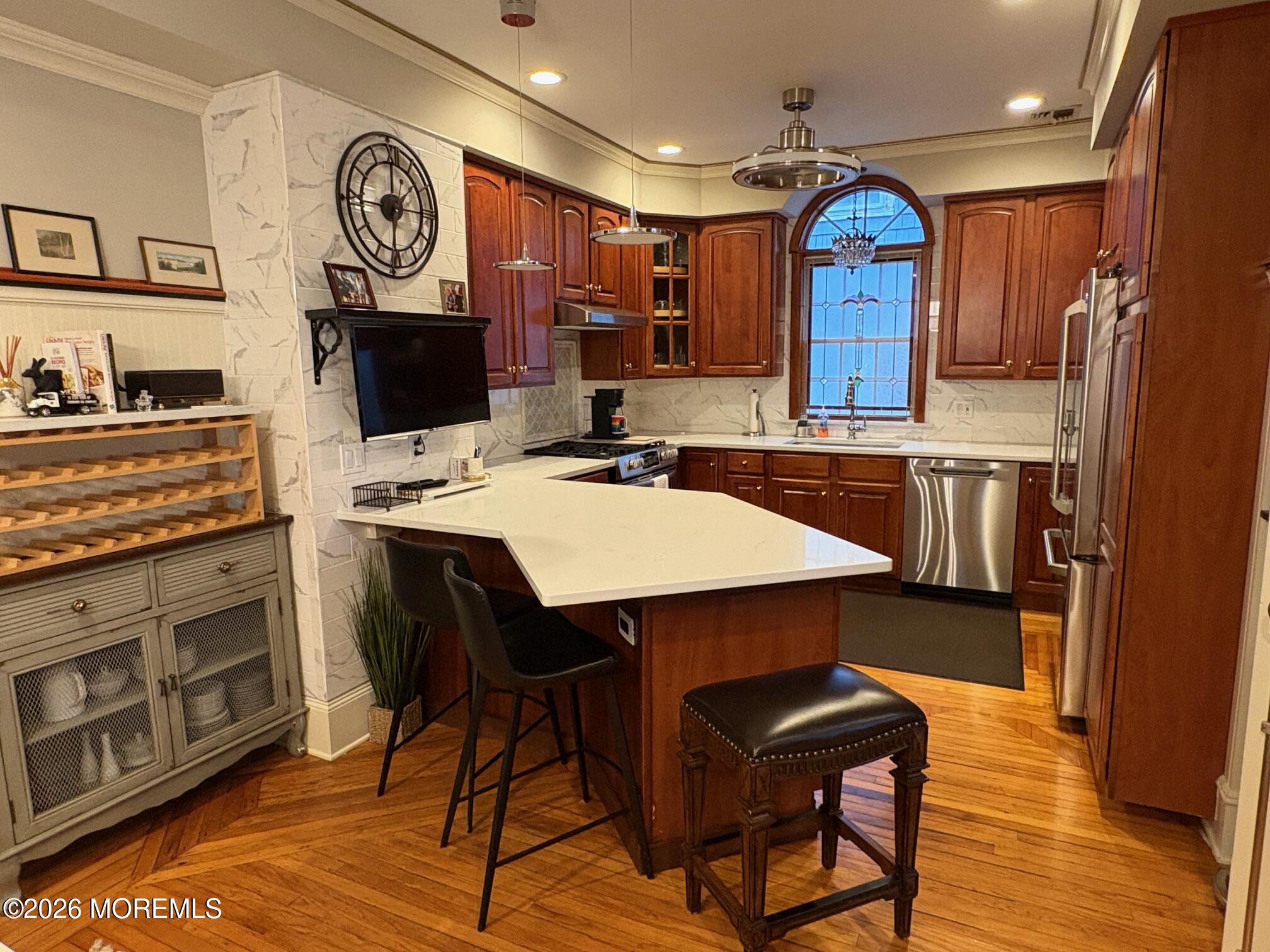 162 Bridge Avenue Red Bank, NJ 07701 - Photo 6 of 27 a kitchen with stainless steel appliances granite countertop a stove top oven microwave and cabinets