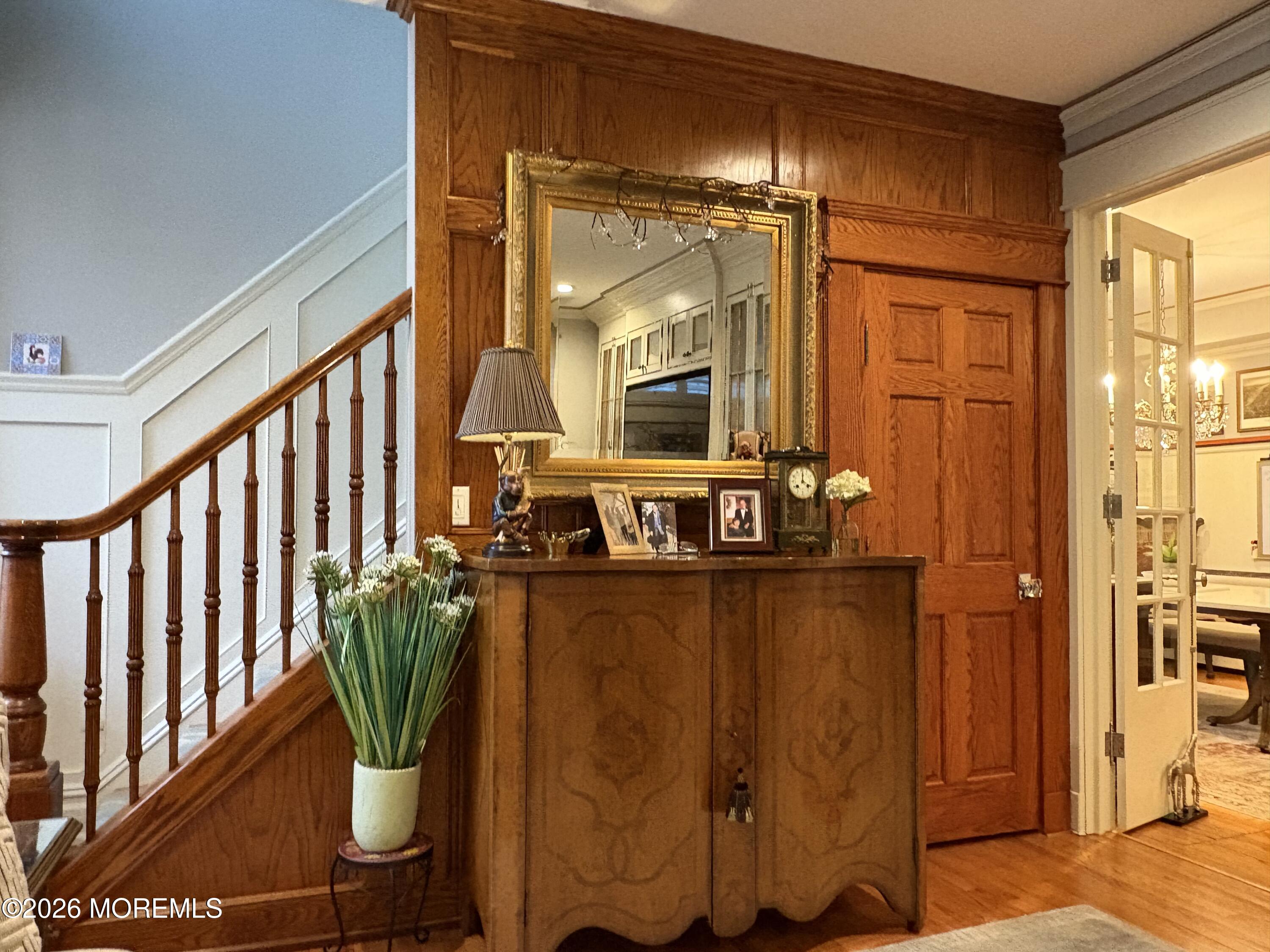162 Bridge Avenue Red Bank, NJ 07701 - Photo 7 of 27 a view of a hallway with wooden floor and glass door