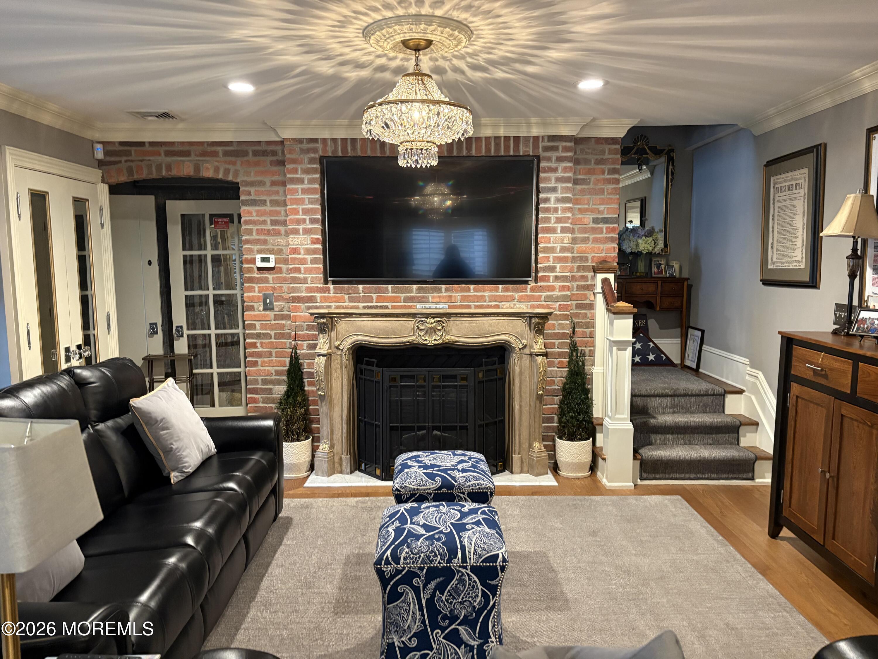 162 Bridge Avenue Red Bank, NJ 07701 - Photo 9 of 27 a living room with furniture a flat screen tv and a fireplace