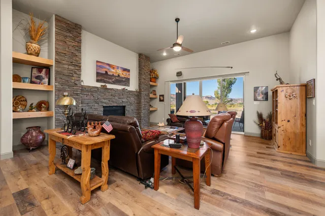 a living room with furniture flat screen tv and a fireplace