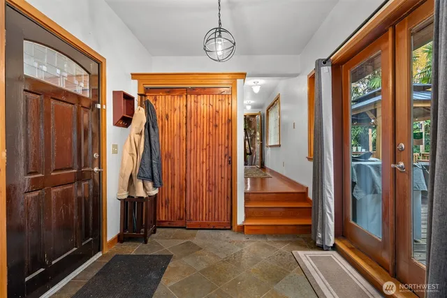a view of a room with door and windows