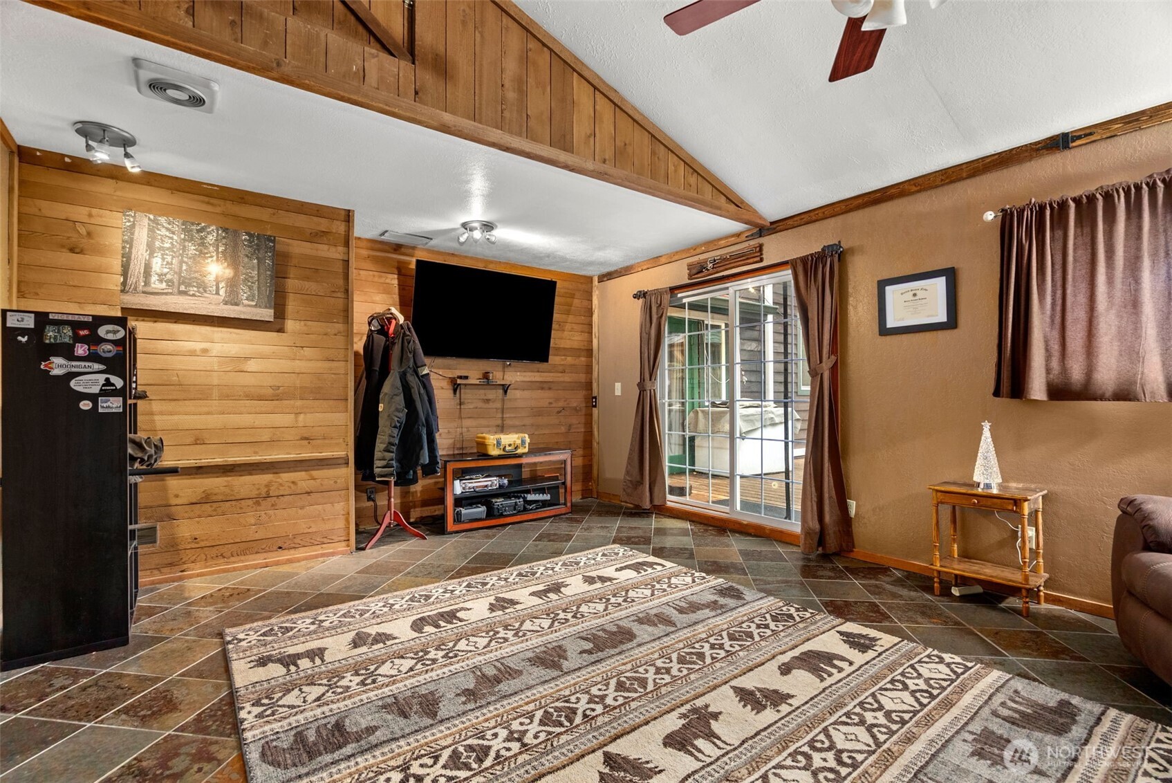4914 182nd Avenue Southwest Longbranch, WA 98351 - Photo 19 of 40 a living room with fireplace furniture and a flat screen tv