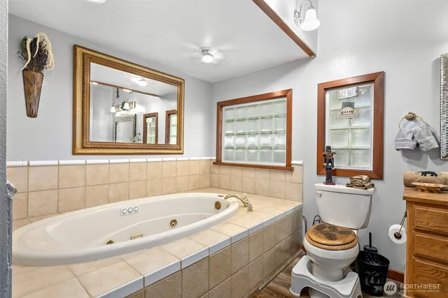 a bathroom with a bathtub and a window