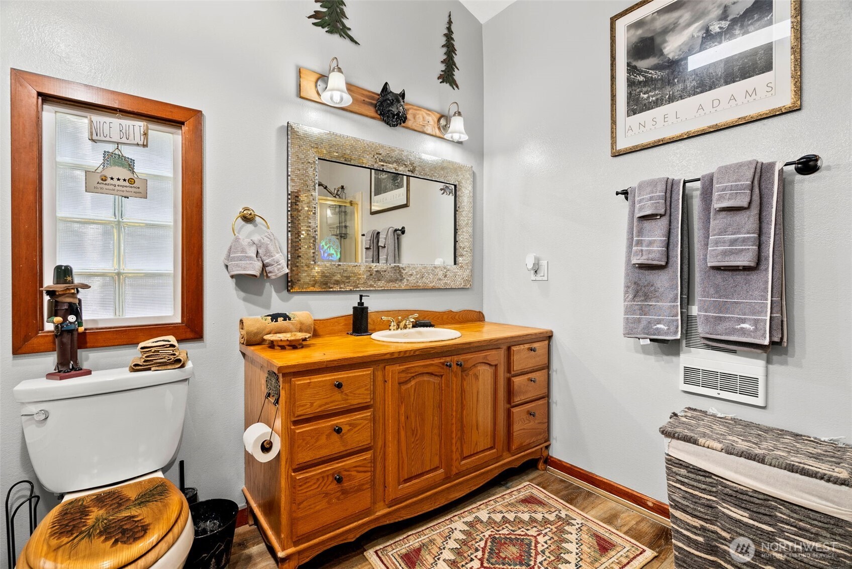 4914 182nd Avenue Southwest Longbranch, WA 98351 - Photo 27 of 40 a bathroom with a sink a toilet and shower