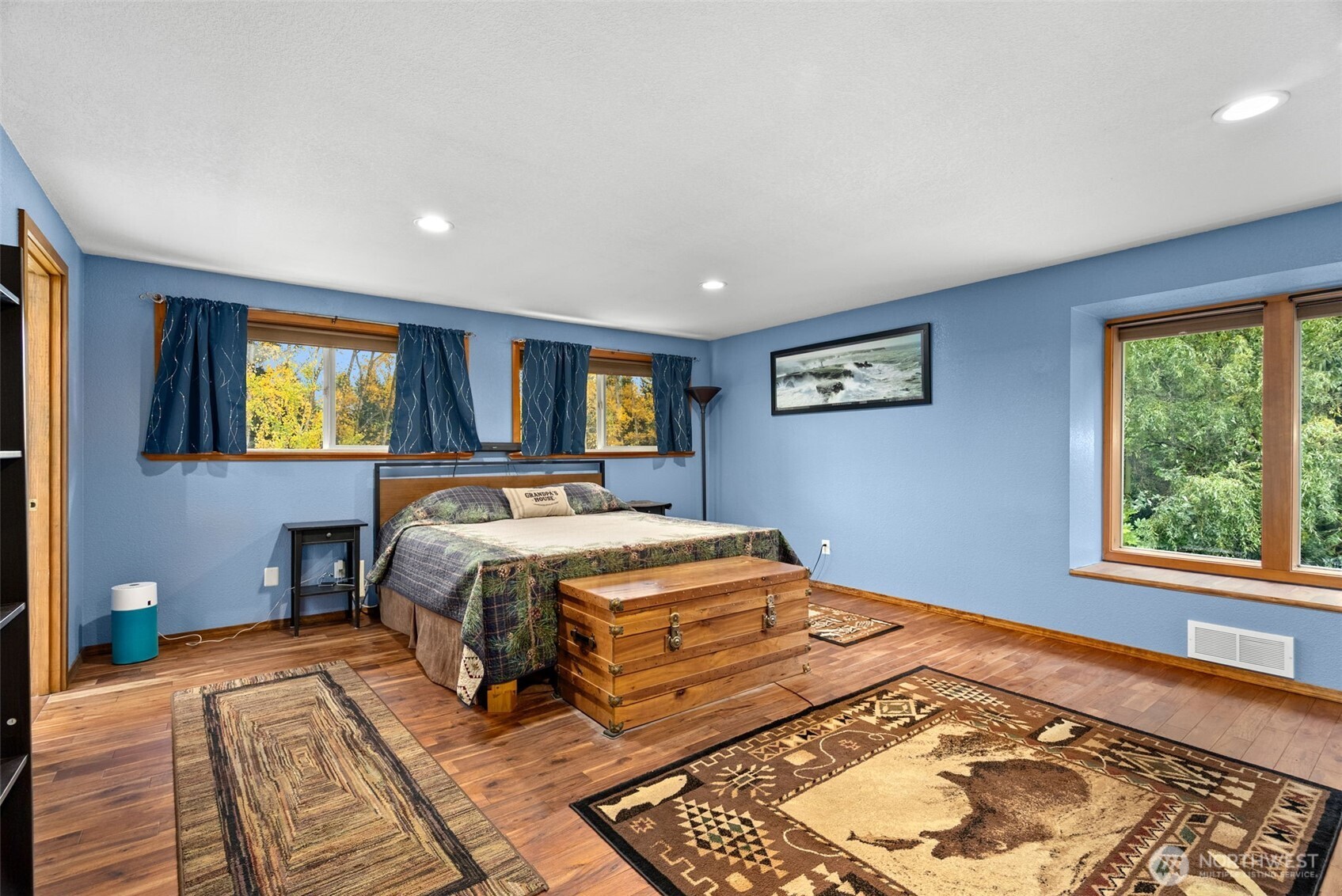 4914 182nd Avenue Southwest Longbranch, WA 98351 - Photo 28 of 40 a bed sitting in a spacious bedroom next to a window