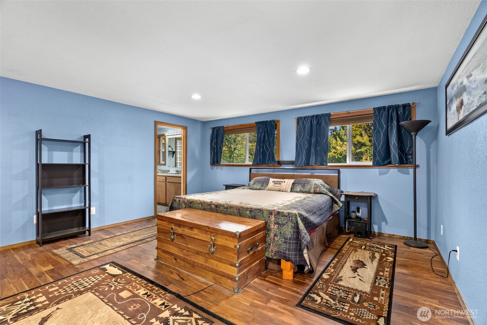 4914 182nd Avenue Southwest Longbranch, WA 98351 - Photo 29 of 40 a bed sitting in a spacious bedroom next to a window