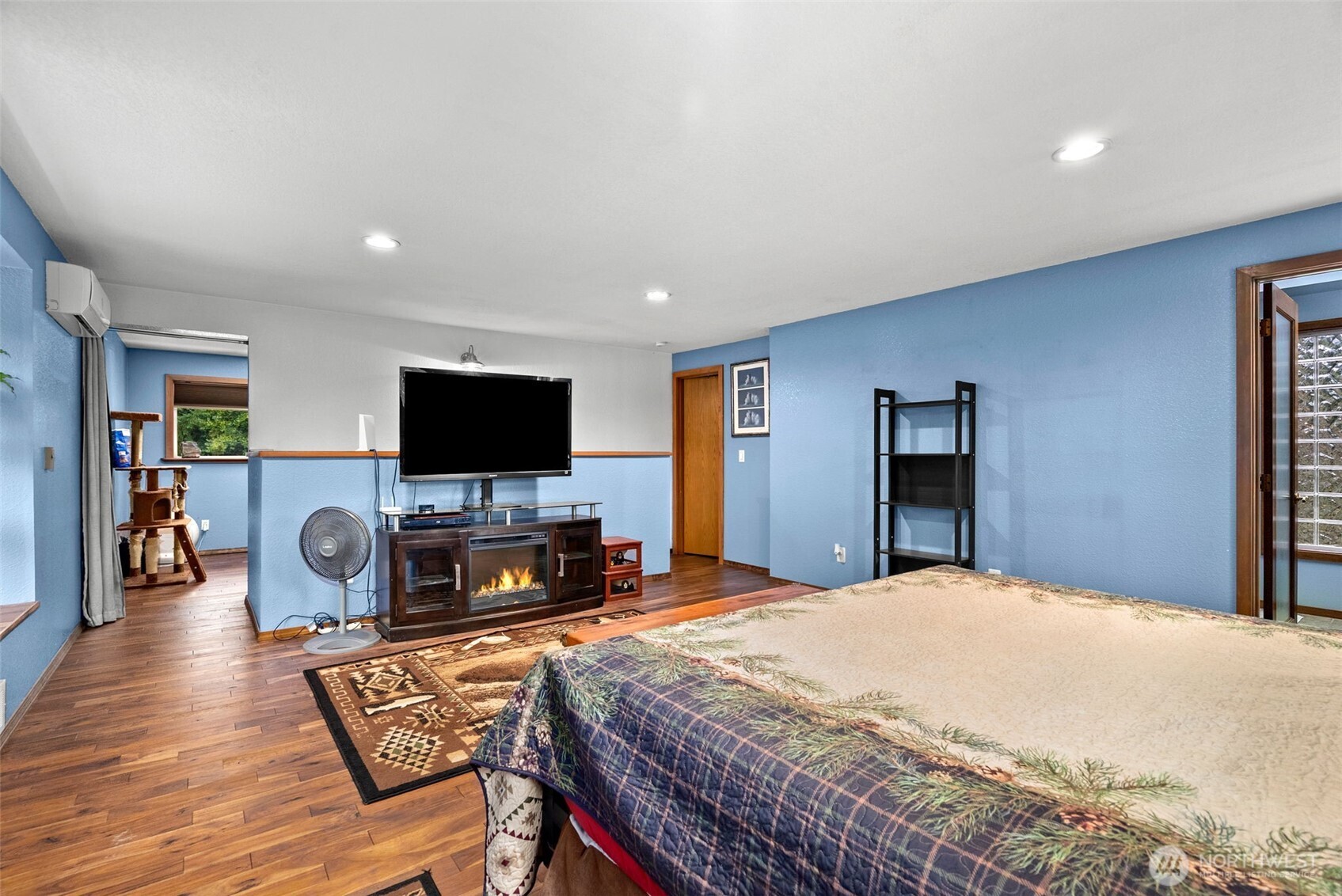 4914 182nd Avenue Southwest Longbranch, WA 98351 - Photo 30 of 40 a bedroom with a bed and a flat screen tv