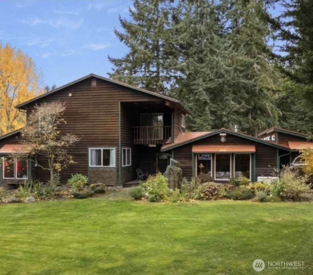 4914 182nd Avenue Southwest Longbranch, WA 98351 - Photo 8 of 40 a front view of house with yard and green space
