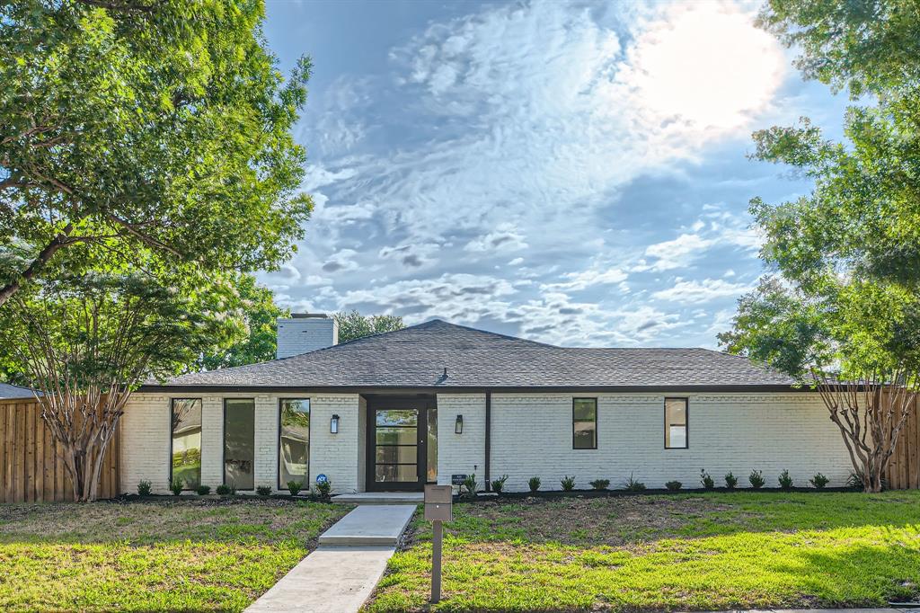 16212 Spring Creek Road Dallas, TX 75248 - Photo 2 of 28 a front view of a house with a yard