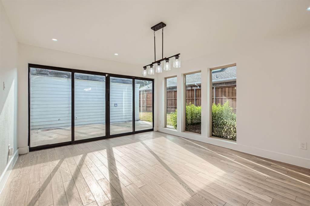 16212 Spring Creek Road Dallas, TX 75248 - Photo 7 of 28 a view of a room with large windows and stairs