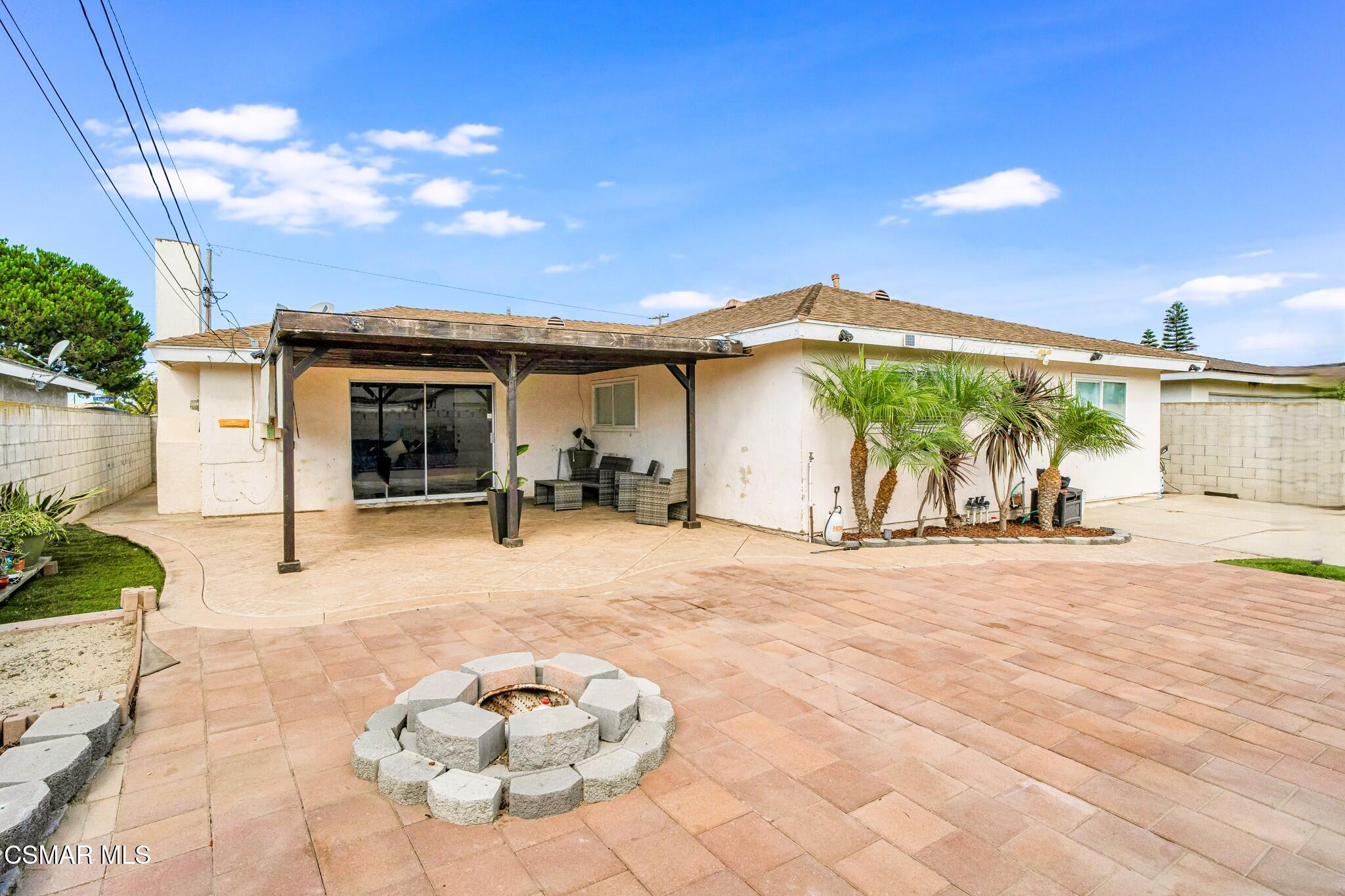 4440 Reeder Avenue Oxnard, CA 93033 - Photo 5 of 27 a backyard of a house with table and chairs
