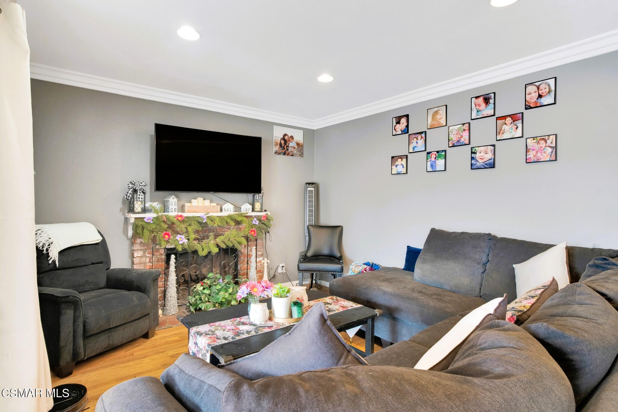 4440 Reeder Avenue Oxnard, CA 93033 - Photo 10 of 27 a living room with furniture and a flat screen tv