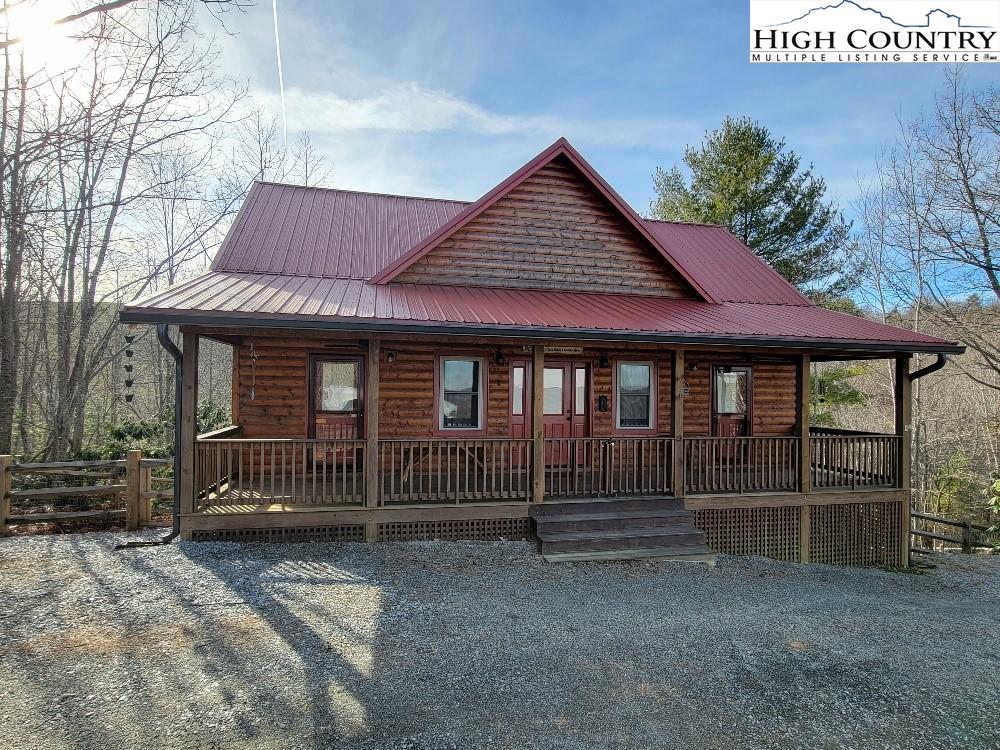 77 Cascades Ridge Ennice, NC 28623 - Photo 4 of 33 a front view of a house with iron fence