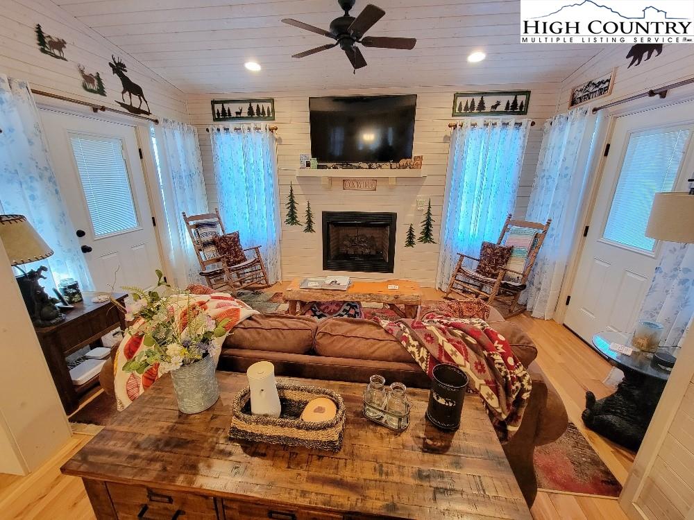 77 Cascades Ridge Ennice, NC 28623 - Photo 8 of 33 a living room with furniture and a flat screen tv