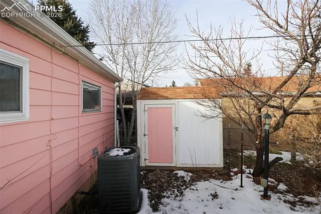 a side view of a house with a yard