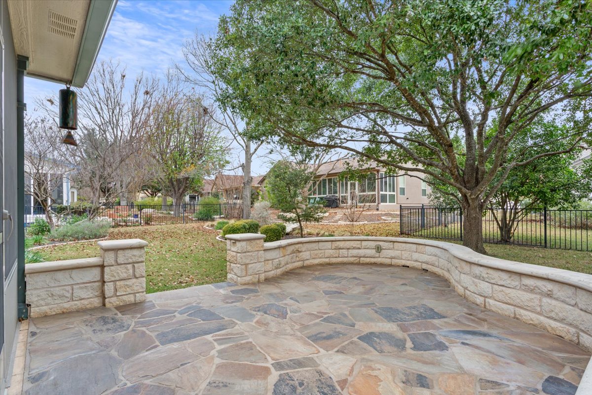 246 Red Poppy Trail Georgetown, TX 78633 - Photo 28 of 32 a view of a white house with a yard and sitting area
