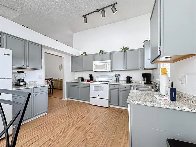 a kitchen with sink and cabinets
