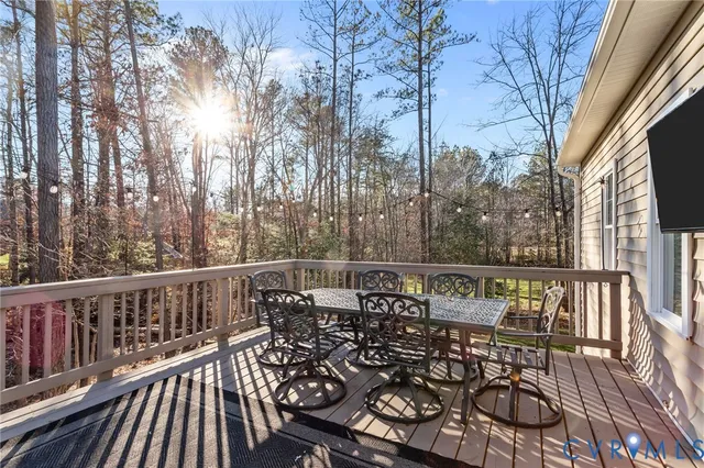 a view of a chairs and table on the deck