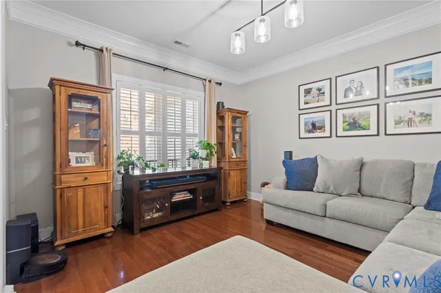 a living room with furniture window and a flat screen tv