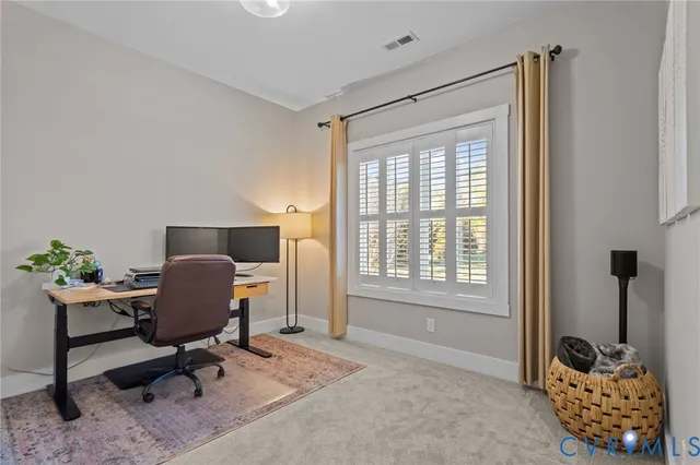 a workspace with furniture and a window